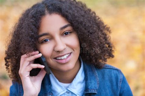 Mixed Race African American Girl Teenager On Cell Phone Stock Image