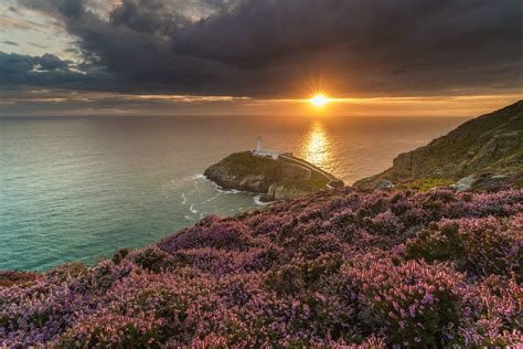 Aerial View Photography Of Lighthouse Surrounded With Sea South Stack