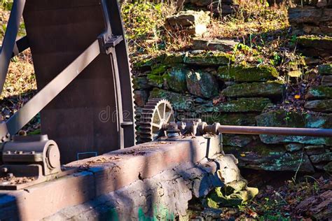 A Water Wheel And Gears From An Old Grist Mill Stock Photo Image Of