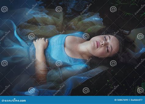 Young Beautiful Drowned Woman In Blue Dress Lying In The River Stock