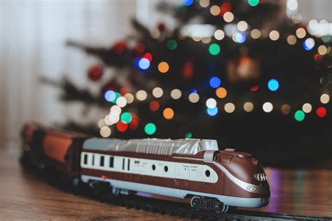 Toy Train Going Around The Christmas Tree 4 Free