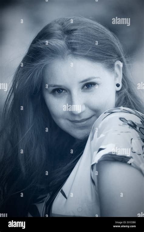 Portrait Of A Beautiful 20 Year Old Redhead Woman Outdoor Toned Image