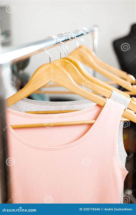 Organic Fashion Rack With Clothes On Hangers In The Store Stock Photo