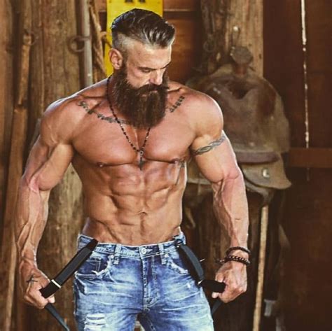 great hair and beard handsome muscular and ripped to the core he has the look of a warrior