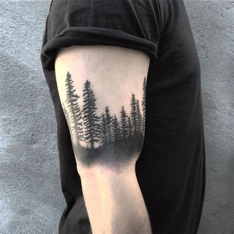 Woods tattoo on the left forearm. Black forest bicep tattoo - Tattoogrid.net