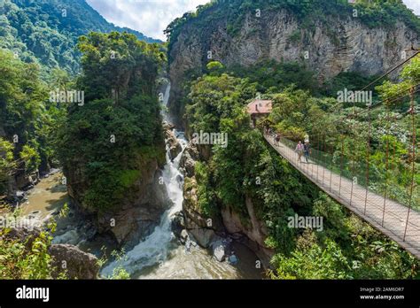 El Pailón Del Diablo Waterfall And Bridge With Tourists On The Pastaza