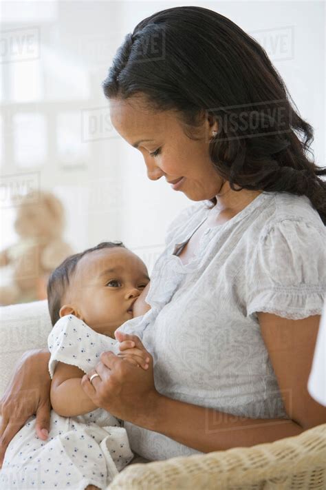 African American Mother Breastfeeding Baby Stock Photo Dissolve