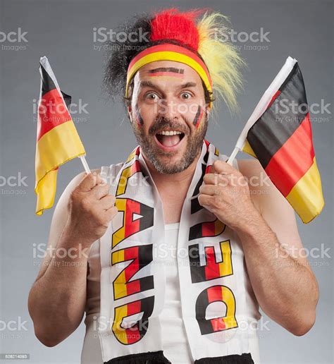 Ecstatic German Soccer Fan Holding German Flags In Both Hands Stock