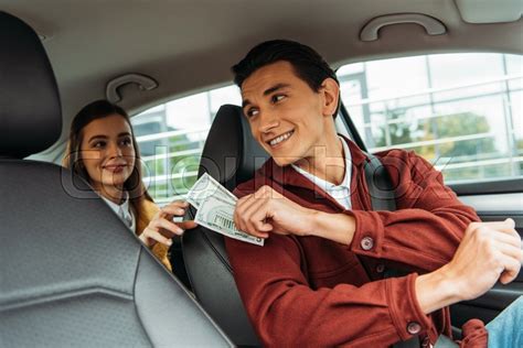 Smiling Passenger Paying Off With Taxi Stock Image Colourbox