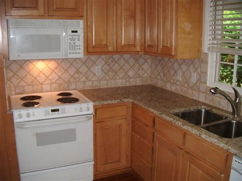 In this kitchen we used arlington oatmeal color cabinetry paired perfectly with our beautiful snowfall granite. Giallo Ornamental Granite Countertops | Beautiful Giallo ...