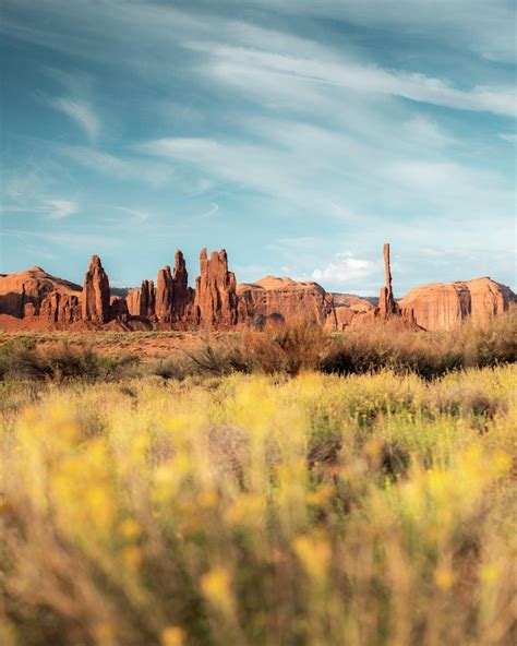 Totem Pole Rock And Its Spire Brothers Standing Tall At Monument Valley