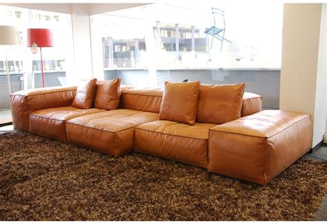 Featuring gently tapered block feet, and roll arms with nailhead trim. Living Divani Sofa | Living room sofa, Sofa design, Tan ...