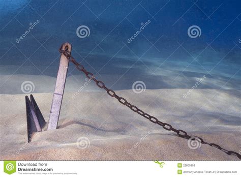 Sand, mud, rock, and weed beds all require different anchor types to ensure the best hold. Anchor Buried In Sand Underwater Stock Image - Image of ...