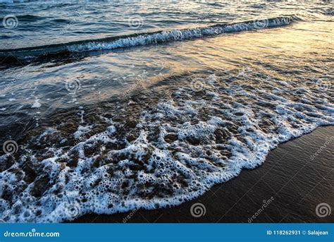 Waves Approaching Sandy Beach During Sunset Stock Image Image Of