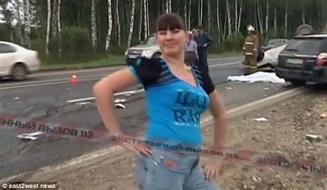 shameful russian car passenger filmed dancing and posing next to dead bodies after surviving