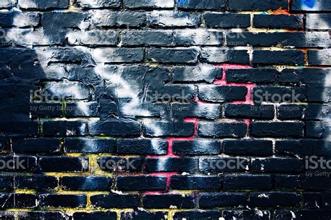 Black Brick Graffiti Wall Background Stock Photo