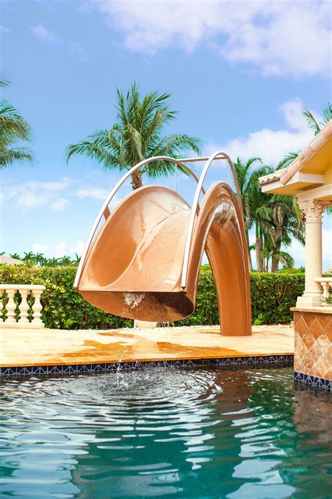 Sleek Sculptural Water Slides For The Modern Pool Luxury Swimming