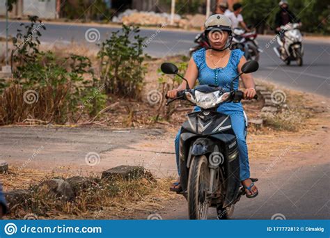 Vietnamese In A National Rides A Motorbike On The Road Editorial