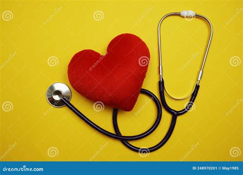 Heart And Stethoscope With Space Copy On Yellow Background Stock Image