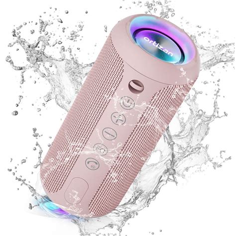 The Bluetooth Speaker Is On Top Of Water Splashing Around Its Surface