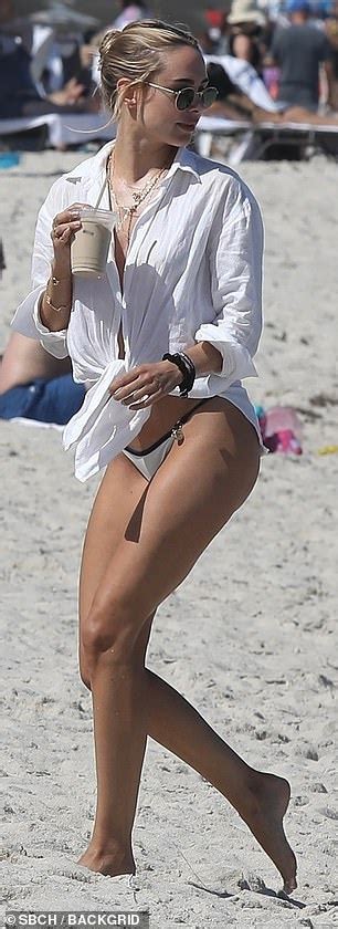 Kimberley Garner Puts On A Cheeky Display In A White Bikini Thong As She Soaks Up The Sun In