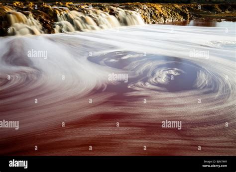 Swirling Water In The Waterfalls Of Rio Tinto Stock Photo Alamy