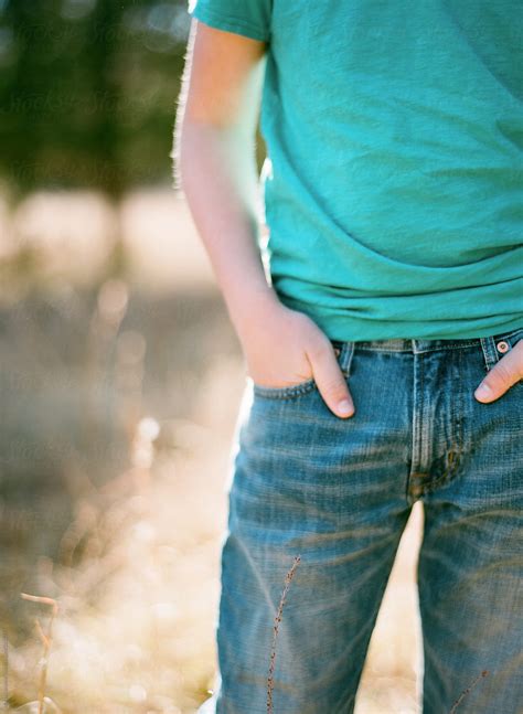 Close Up Of Boy Wearing Jeans And Hands In Pockets By Stocksy