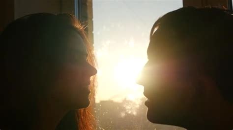 A Loving Couple Kissing In The Sunset At The Window Slow Motion — Stock Video © Gaikakatmail
