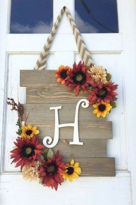 This beautiful door hanger is made with a moss coverered grapevine. 40 Front Door Initial/Monogram Ideas