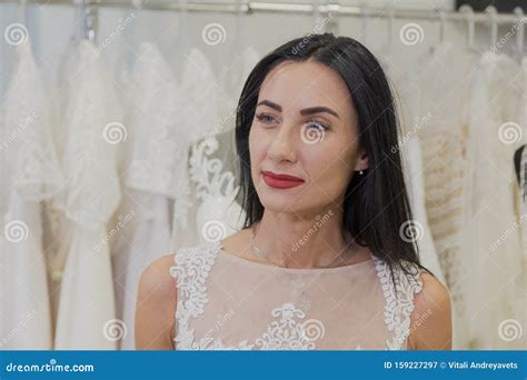 Beautiful Girl Tries On A Wedding Dress In A Bridal Salon Stock Image