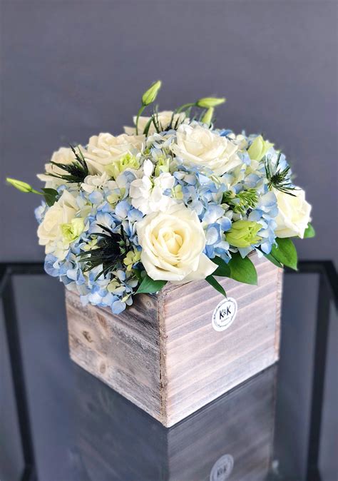 Large wood box arrangement for a table with white roses, blue