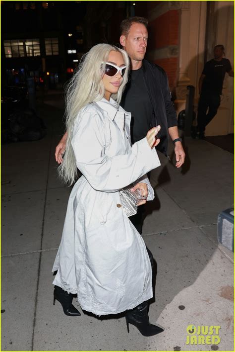 Kim Kardashian Pairs White Trench Coat With Thigh High Leather Boots For Dinner In Nyc Photo