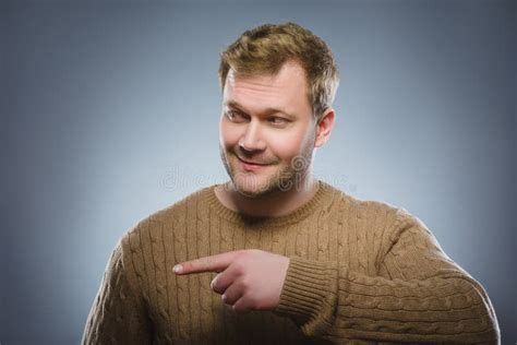 Portrait Handsome Smiling Man Pointing Fingers To The Side Isolated On
