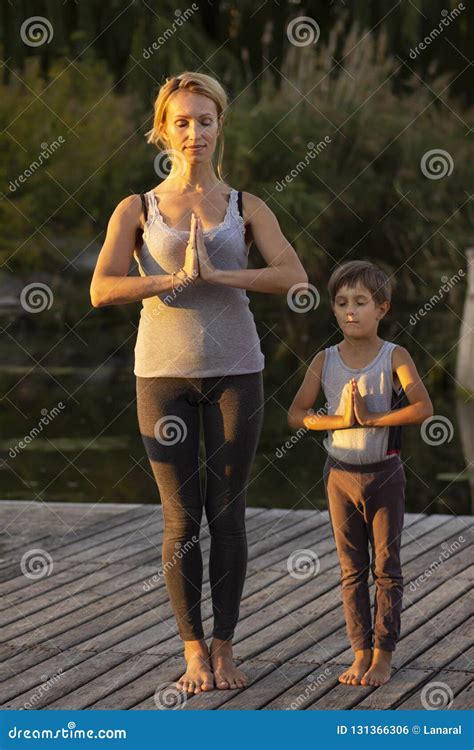 Mother And Son Exercising Yoga Pose Stock Photo Image Of Peaceful European