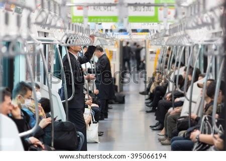 Passengers Traveling By Tokyo Metro Business People Commuting To Work By Public Transport In