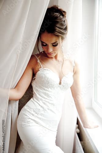 Photo Stock Beautiful Happy Bride In White Silk Lingerie In Her Bedroom In A Morning Adobe Stock