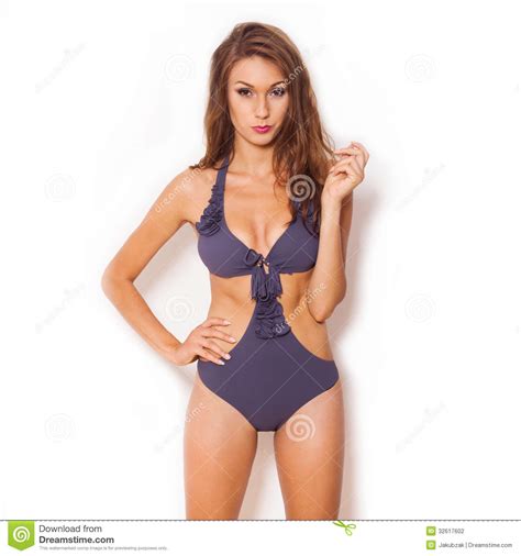 Brown Haired Beauty In A Bikini Posing Before A White Background Stock Photo Image Of