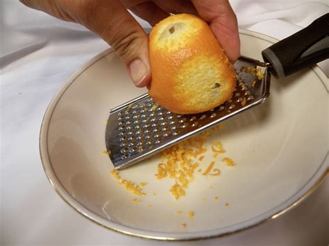 Scoop it into a using a vegetable peeler or knife will leave you with larger strips of zest. How To's Wiki 88: How To Zest An Orange In Strips