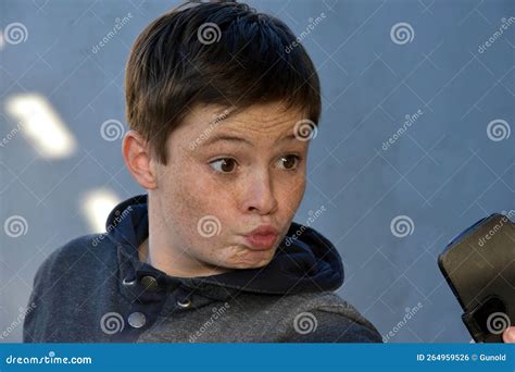 Teenage Boy Makes Funny Face While Taking A Selfie Stock Photo Image