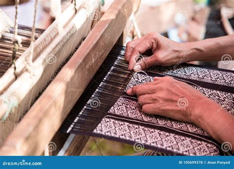 Close Up Weavers Are Weaving With A Loom And Threading Stock Photo