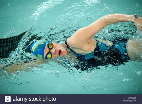 Woman Doing Laps In Swimming Pool Stock Photo Alamy