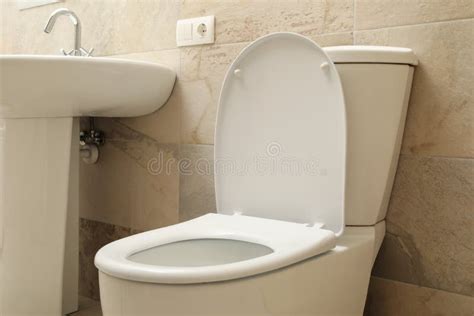 Toilet Bowl In Modern Bathroom In Light Beige Color Stock Image Image Of Domestic Wall