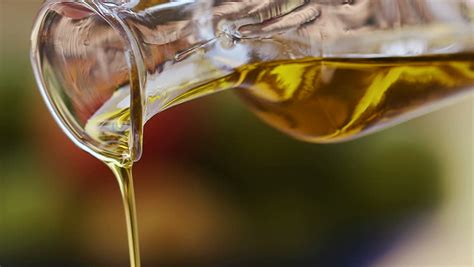 Pouring Extra Virgin Olive Oil From Glass Bottle Stock Footage Video