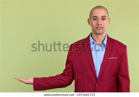 Handsome Bald Multi Ethnic Businessman Showing Stock Photo 1455681731