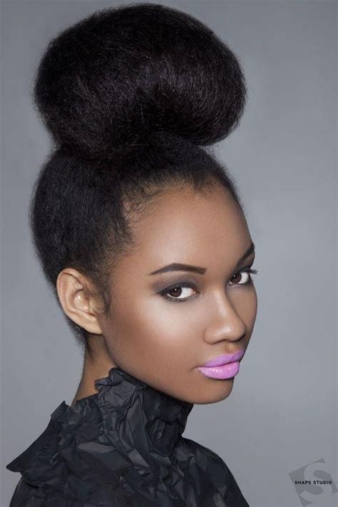 An oversized, voluminous bun is a great protective style for natural hair—and, as a bonus, it shows off natural texture. High Buns - Black Hair Information Community | High bun ...
