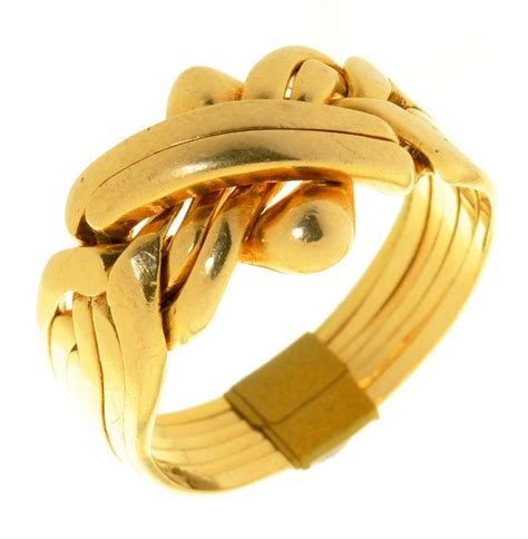 A Gold Puzzle Ring Marked 18k 105g Size U ½