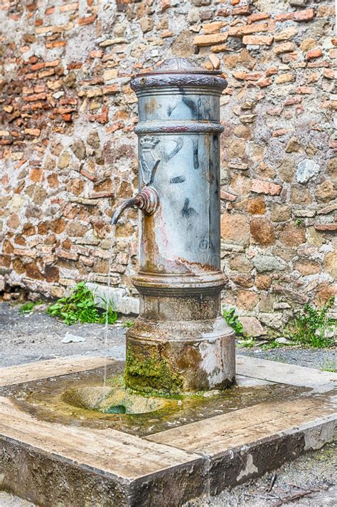 Traditional Free Water Public Fountain In Rome Italy Stock Image