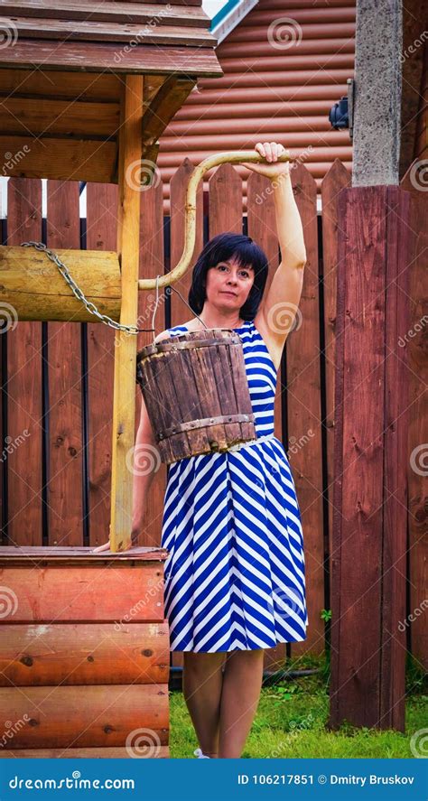 Brown Haired Middle Aged Woman In The Village Toning Stock Image