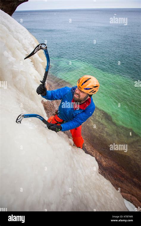 An Ice Climber In Northern Michigan Climbing At Pictured Rocks