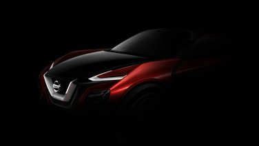 The Nissan Concept Sports Car Is Shown In Black And Red Lighting With Its Hood Up